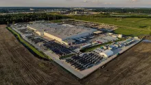 Aerial photograph of the xAI Colossus data center in Memphis, surrounded by rows of cooling and power equipment.