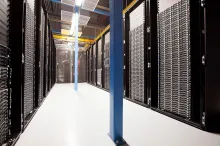 Rows of rack-mounted servers in a data center that hosts virtual machines for multiple tenants.