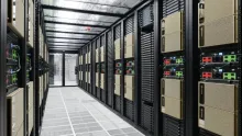 Rows of Nvidia DGX AI server systems installed in a data center aisle.