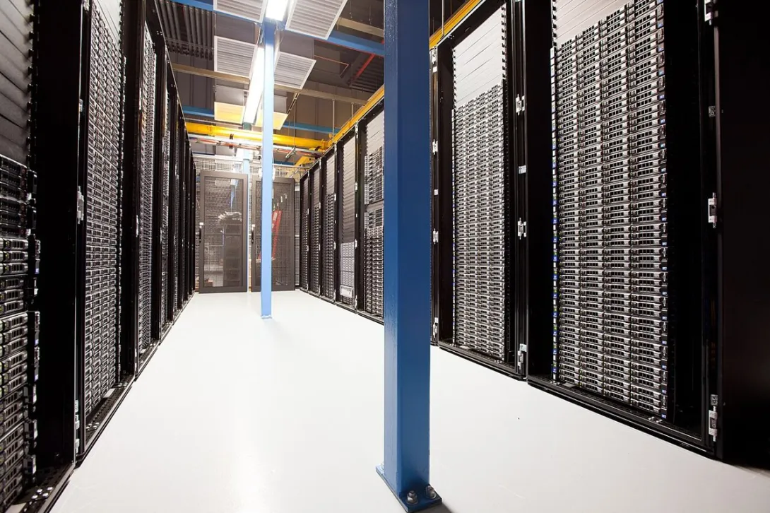 Rows of rack-mounted servers in a data center that hosts virtual machines for multiple tenants.