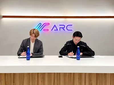 ARC Cloud board member Adam Huang and Compal chief strategy officer Douglass Chen sign their AI infrastructure partnership at the 2026 OCP Global Summit.