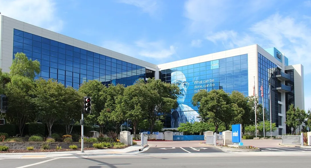 Intel's headquarters building in Santa Clara, California, with blue glass facades and an Intel sign at the entrance.