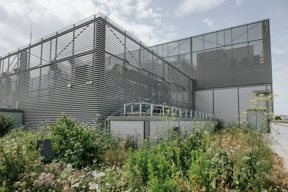 Nebius's Paris data center at the Equinix PA10 campus in Saint-Denis, photographed from its rooftop urban farm, which is heated by waste heat from the servers.
